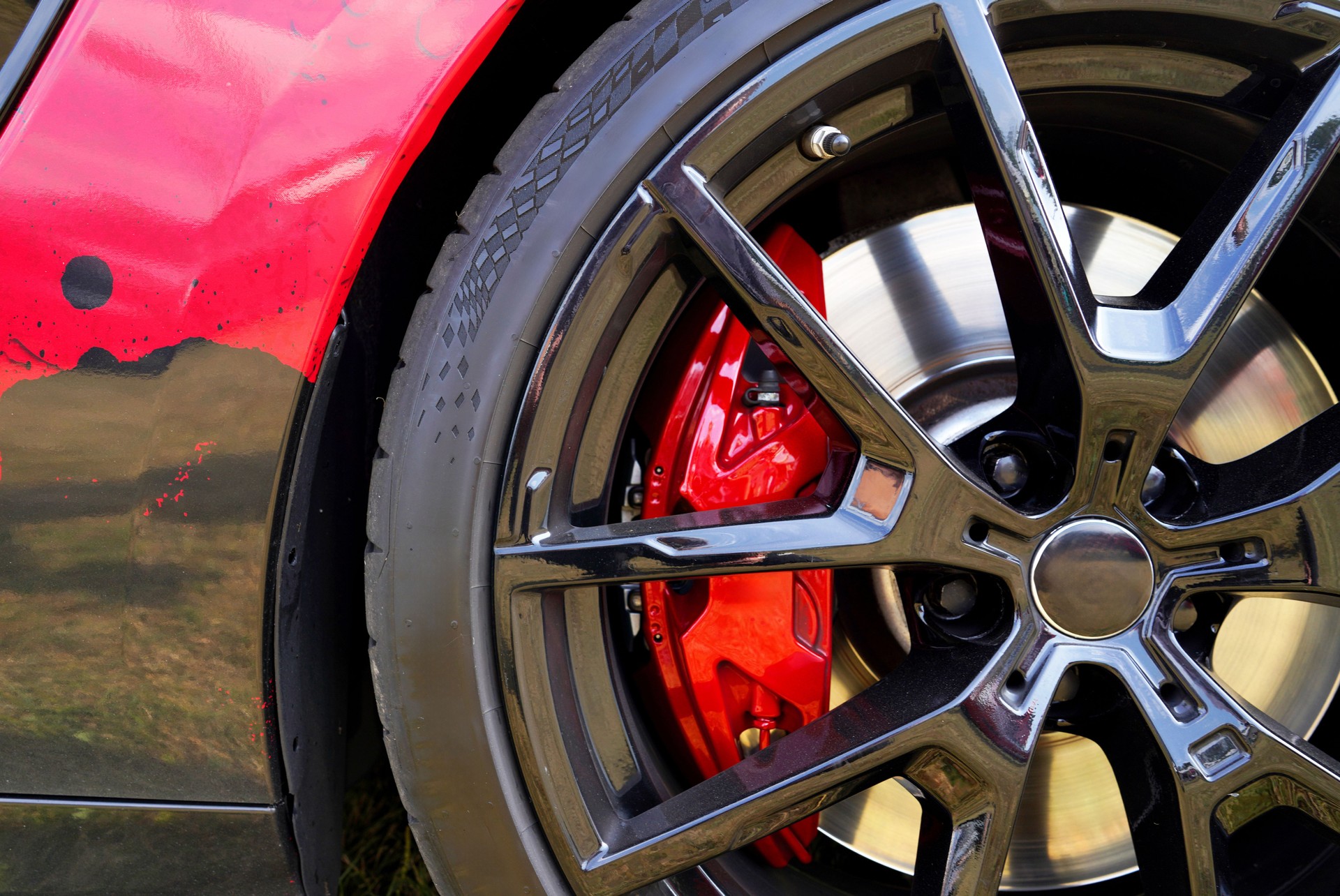 Alloy wheel with calipers and racing brakes of the sport car.